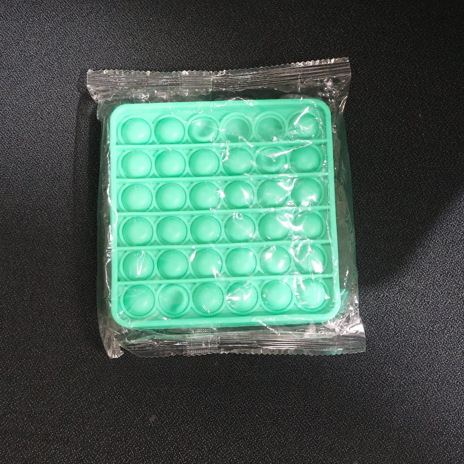 Wukusy premium square silicone pop it fidget toy with colorful bubbles for sensory play and stress relief.