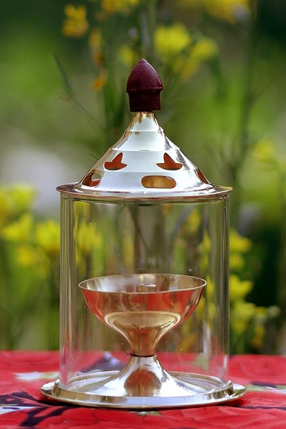 Brass and glass Akhand Deep Diya with cover for puja, traditional oil lamp for religious ceremonies and spiritual lighting.