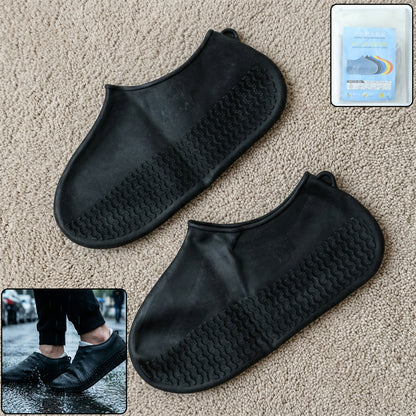 Pair of black waterproof silicone shoe covers by Wukusy, medium size, designed to protect shoes from water and dirt.