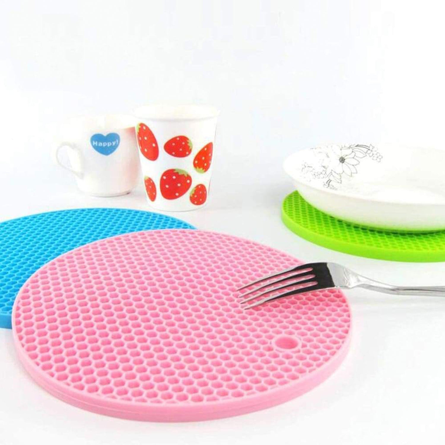 Wukusy 4-piece silicone hot mat set with textured surface, ideal for placing hot pots and utensils without marking surfaces.
