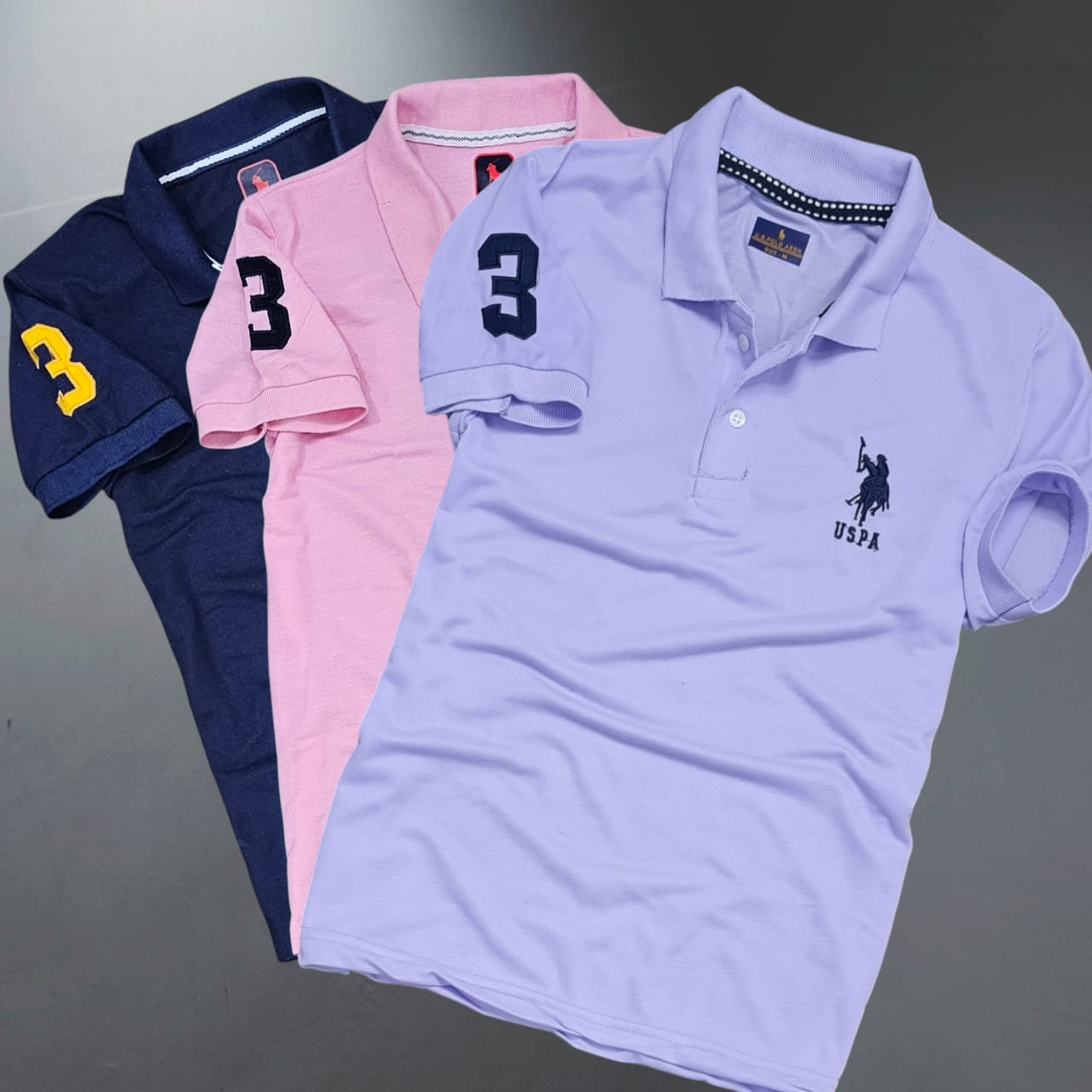 Pack of three multicolor men's polo neck T-shirts by 8969, casual short-sleeve T-shirts for men in various colors.