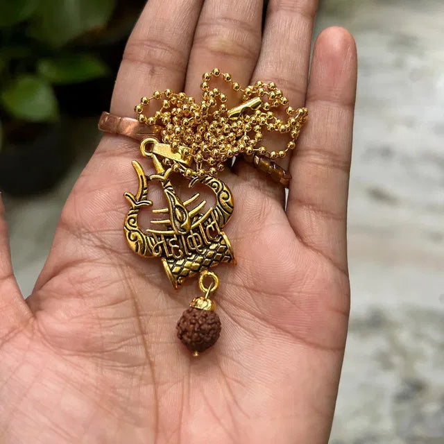 Spiritual Shiva Trishul and Damaru necklace, pooja article from 8995, featuring traditional religious symbols for spiritual practices.