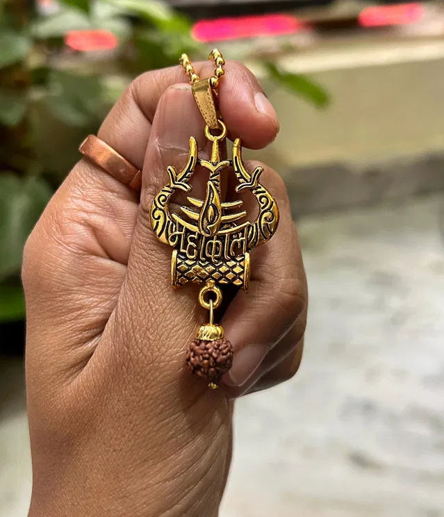 Spiritual Shiva Trishul damaru necklace, traditional pooja article, featuring symbolic pendant with intricate design and religious significance.