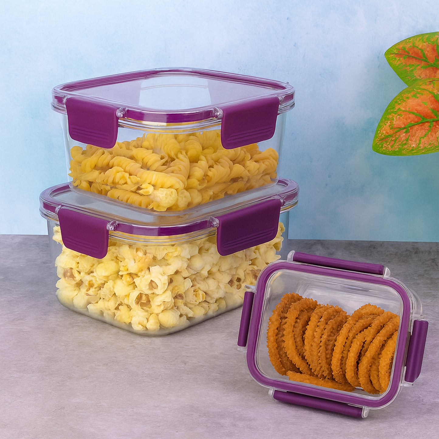 Wukusy airtight square food storage container set with three clear plastic containers and snap-on lids for kitchen organization.