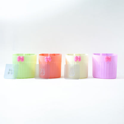Wukusy wall-mounted bathroom toothbrush holder set with four durable plastic holders for toothbrushes and toothpaste.