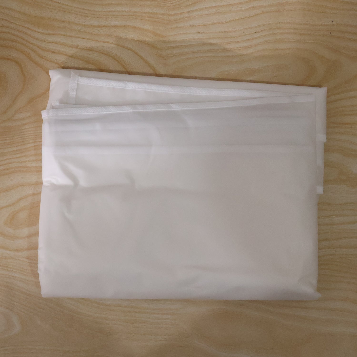 Set of five Wukusy foldable non-woven suit covers for storing and protecting coats and clothing.