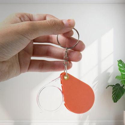 Wukusy portable mini folding magnifier keychain with compact design, ideal for office use, showing a clear magnifying lens and keyring attachment.