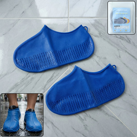 Pair of blue waterproof silicone shoe covers by Wukusy in medium size, designed to protect shoes from water and dirt.