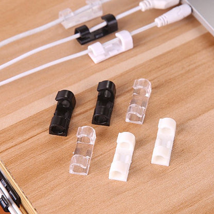 Set of 20 Wukusy plastic clips with strong adhesive tape for cable management, wire organization, and cord holding in car, office, or home.