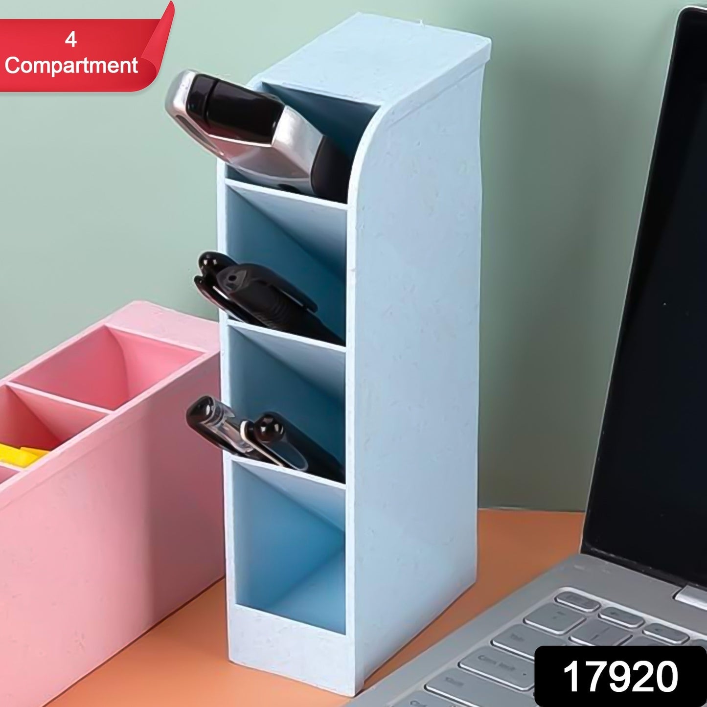 Wukusy multipurpose 4-compartment pen holder on an office desk with pens and stationery inside.