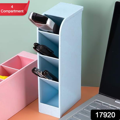 Wukusy multipurpose 4-compartment pen holder on an office desk with pens and stationery inside.