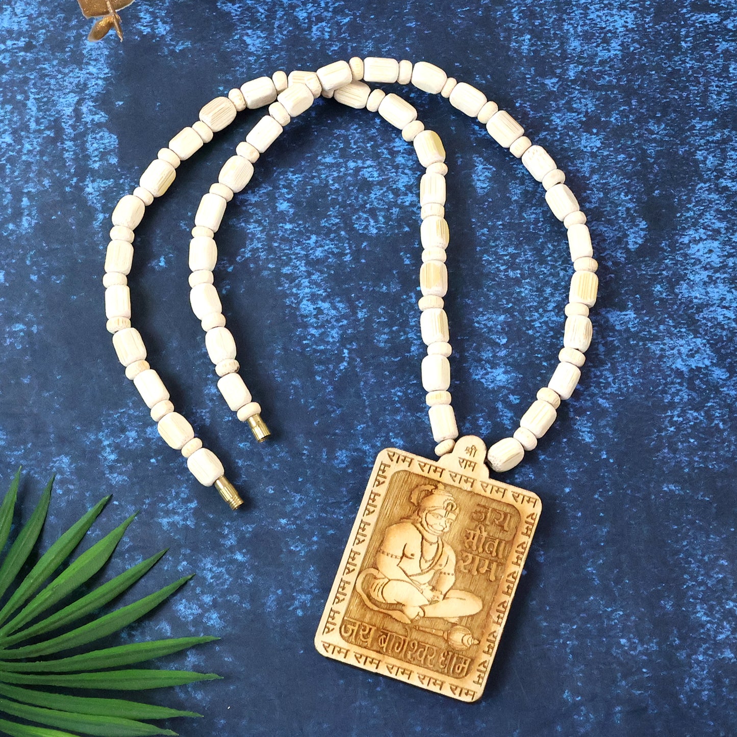 Wooden Hanuman pendant mala from Wukusy showing intricately carved wooden beads and a detailed Hanuman figure pendant.