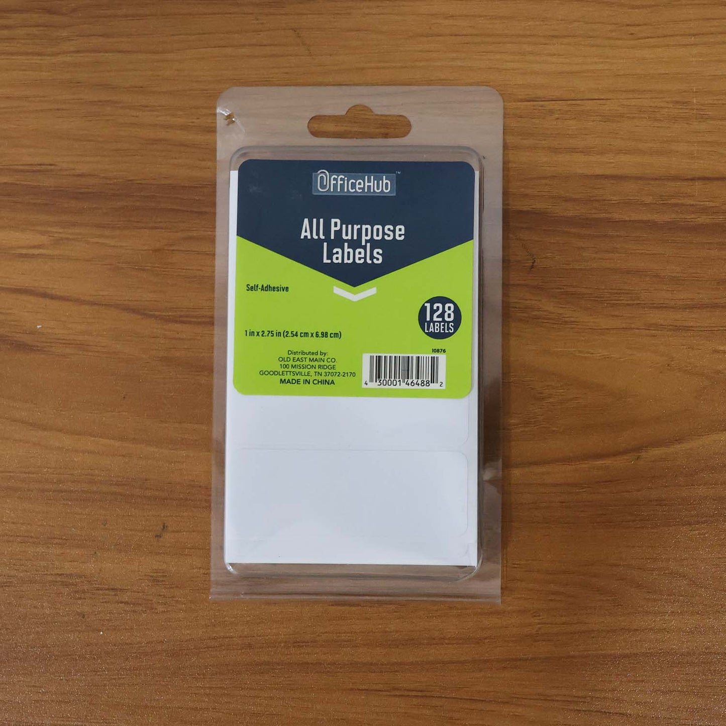 Wukusy premium all purpose adhesive white labels, 128 sheets for office use, shown in a stack with some labels peeled.