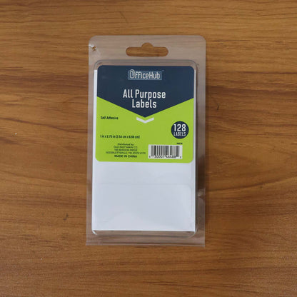 Wukusy premium all purpose adhesive white labels, 128 sheets for office use, shown in a stack with some labels peeled.