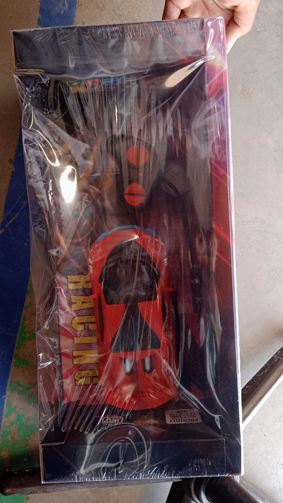 Wukusy high-speed RC sports car with spray exhaust effect, detailed body design, and vibrant colors on a smooth surface.
