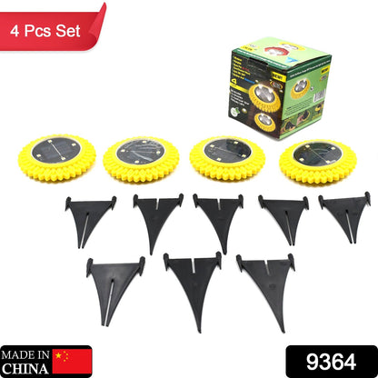 Wukusy 4-pack solar garden ground lights with LED disks, waterproof outdoor landscape lighting for yard, deck, lawn, and pathway.