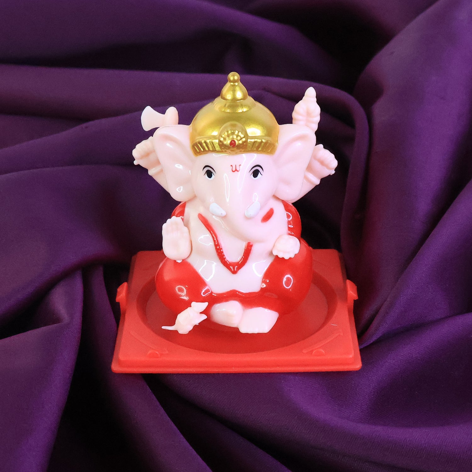 Small Lord Ganesh idol in a transparent display case, ideal for home decor, by Wukusy.