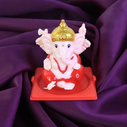 Small Lord Ganesh idol in a transparent display case, ideal for home decor, by Wukusy.