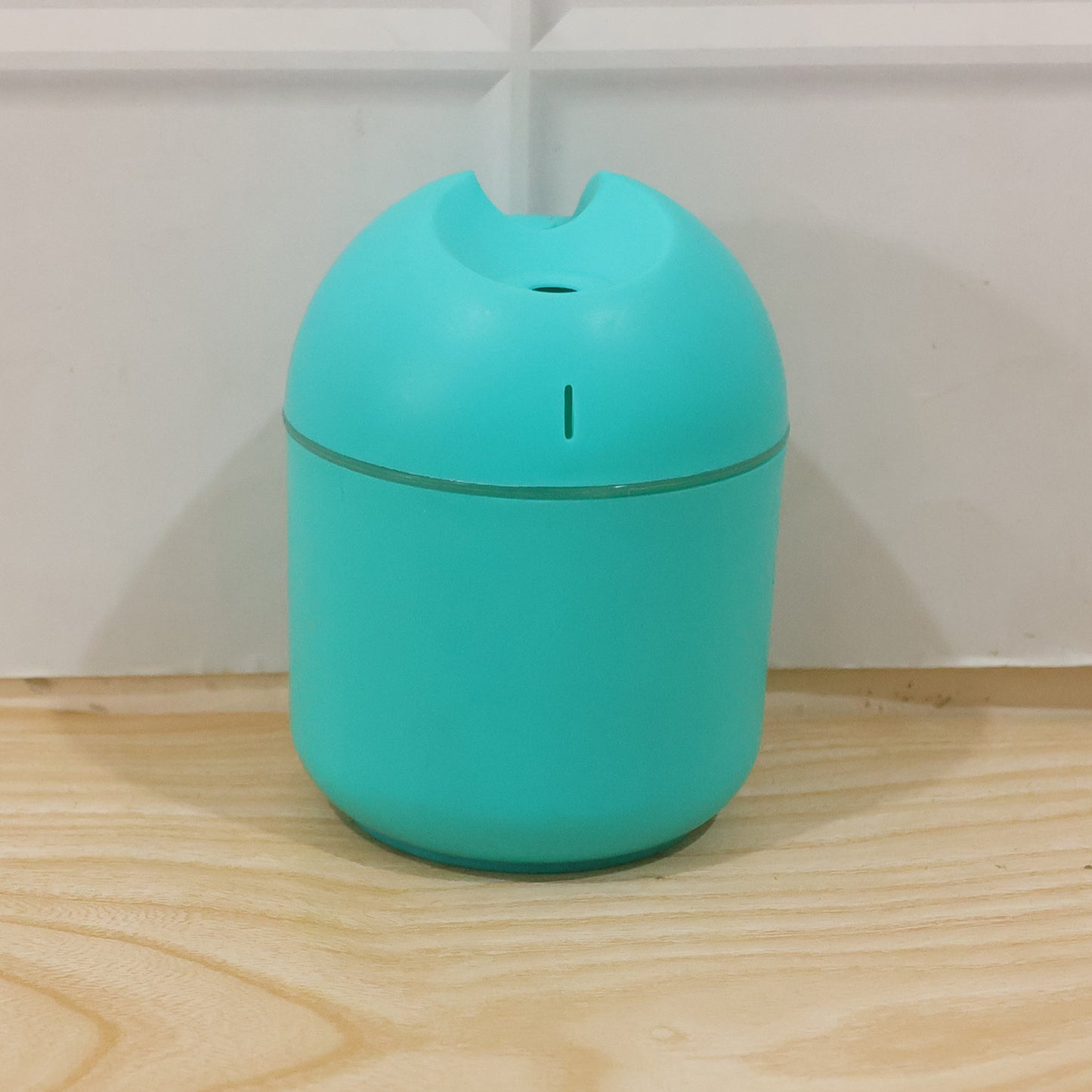 Wukusy portable USB mini air humidifier with cool mist, compact device emitting mist for improved air quality