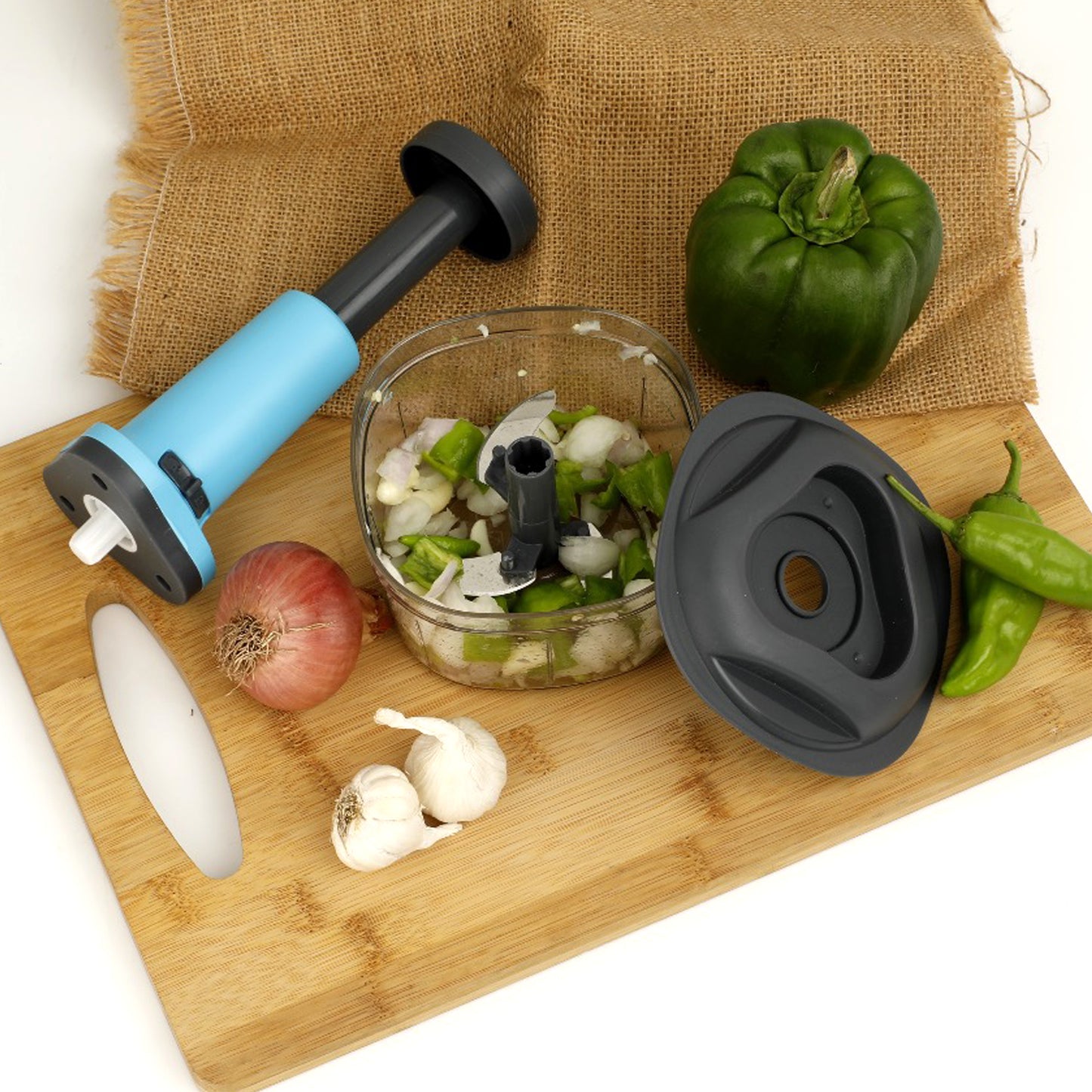 Wukusy 5902 manual push food chopper with three stainless steel blades for vegetables and kitchen prep.
