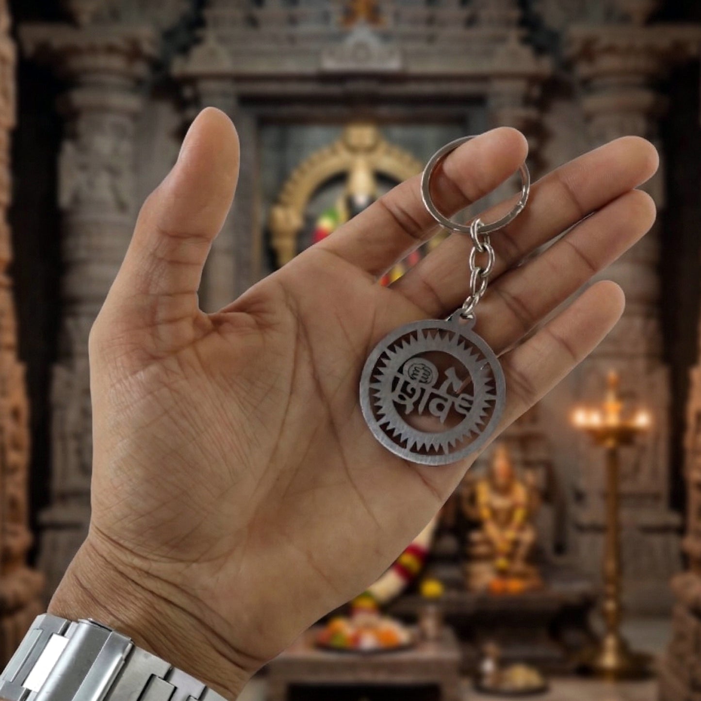 Metal round Shiv keychain by Wukusy, featuring a polished silver finish with intricate engraved design.