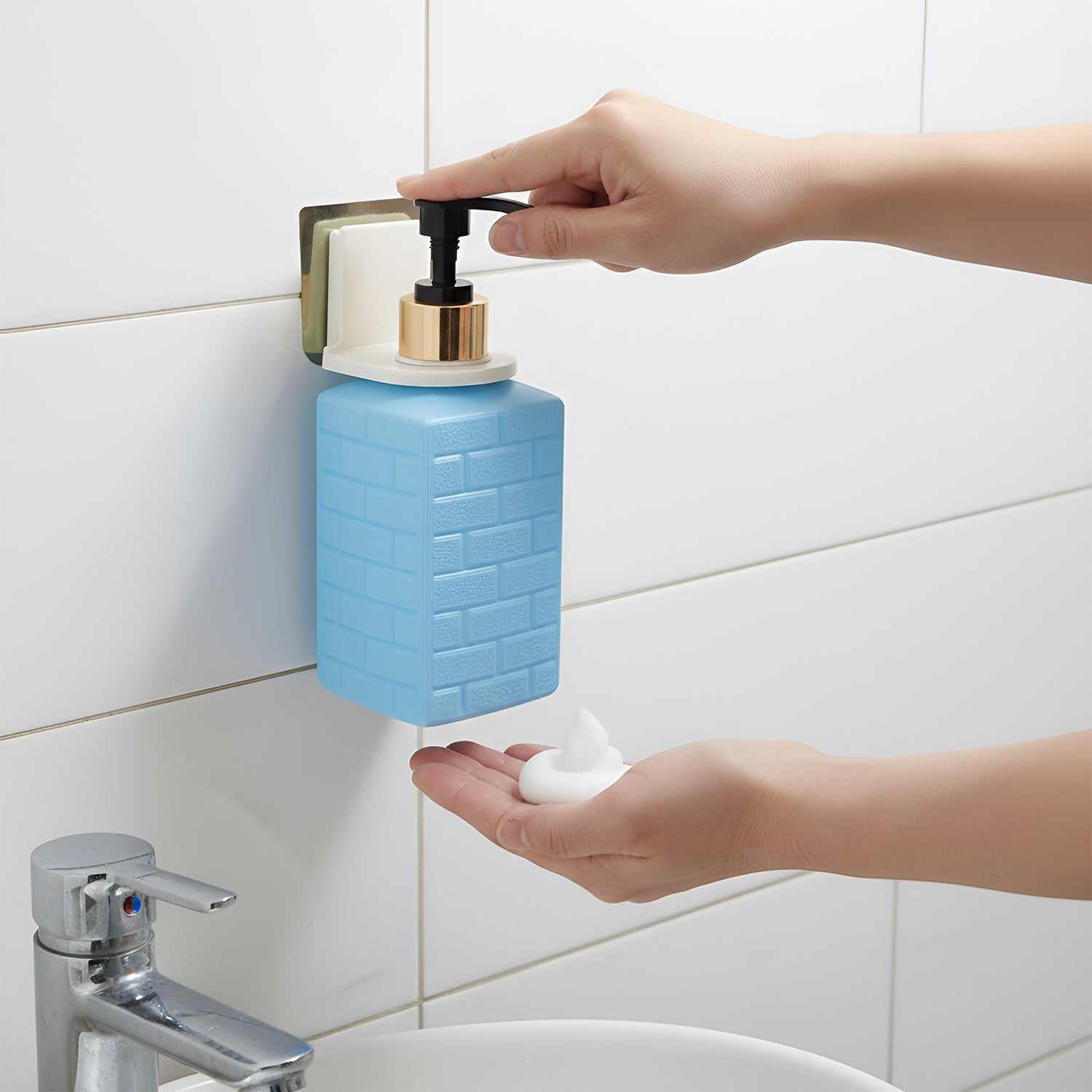 Wall-mounted Wukusy liquid soap dispenser set with sleek design and pump mechanism, mounted on a bathroom wall.