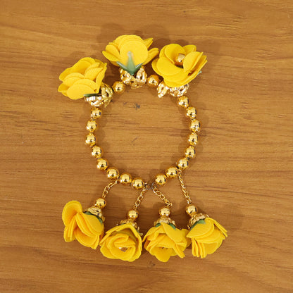Traditional Pooja wrist ornament Haldi Kada bracelet by Wukusy, featuring gold-toned design with intricate detailing.