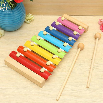 Colorful 1912 Wooden Xylophone musical toy for children by Wukusy, featuring vibrant bars and a small mallet for play.