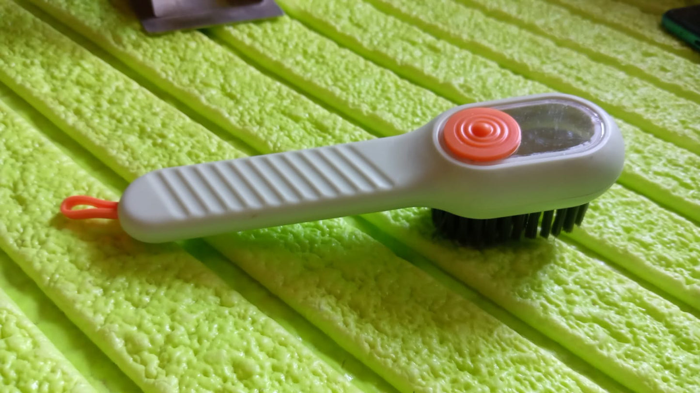 Wukusy multifunctional scrubbing brush with liquid soap dispenser, handle, and shoe cleaning brush for home cleaning tasks.