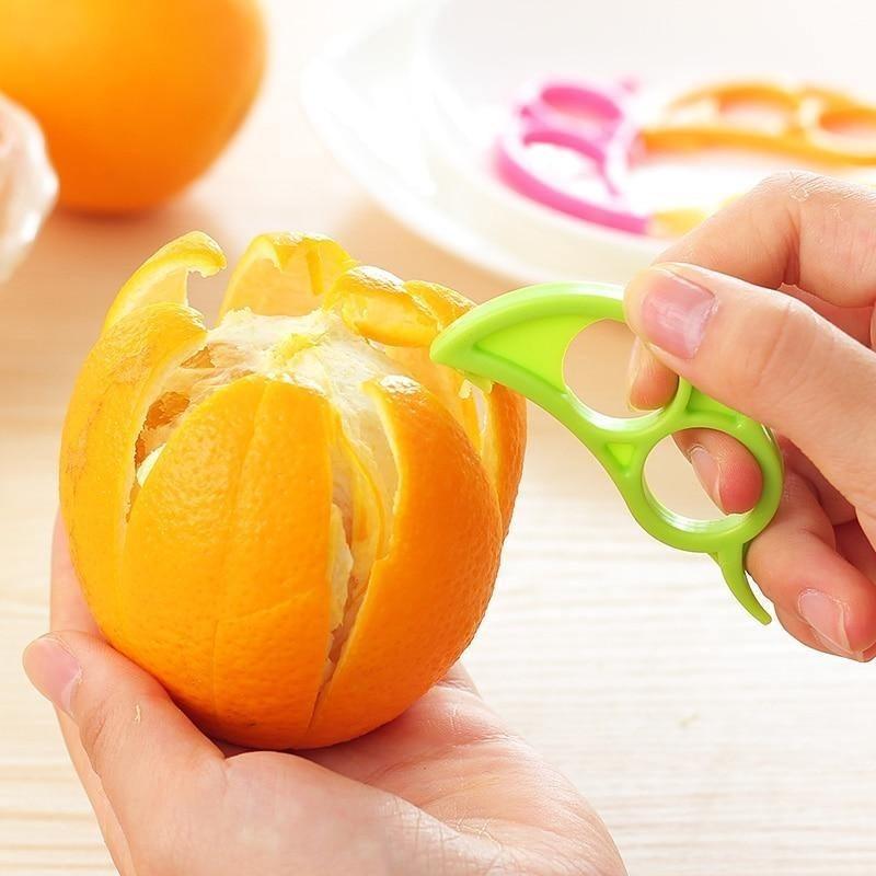Wukusy Snail Barker creative ring-shaped orange peeler with ergonomic design for easy fruit peeling, shown in use.