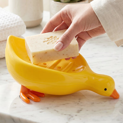 Cute duck-shaped plastic soap holder box for bathroom, featuring a kid-friendly soap dish tray with Wukusy branding.