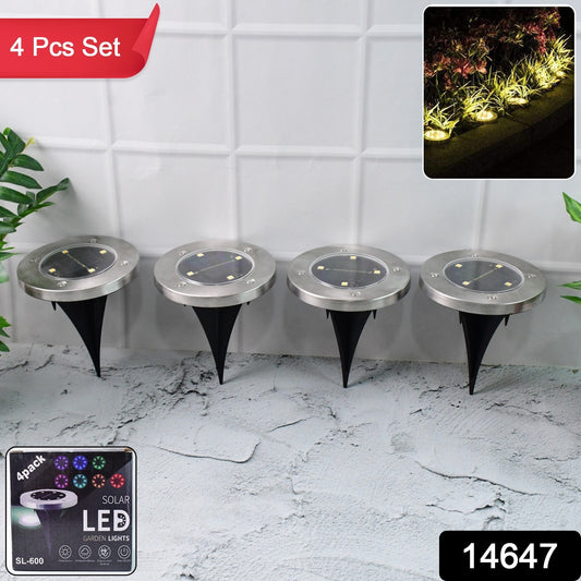 Wukusy solar powered LED garden lights, 4-piece set, outdoor garden lighting with solar panels and warm LED illumination.