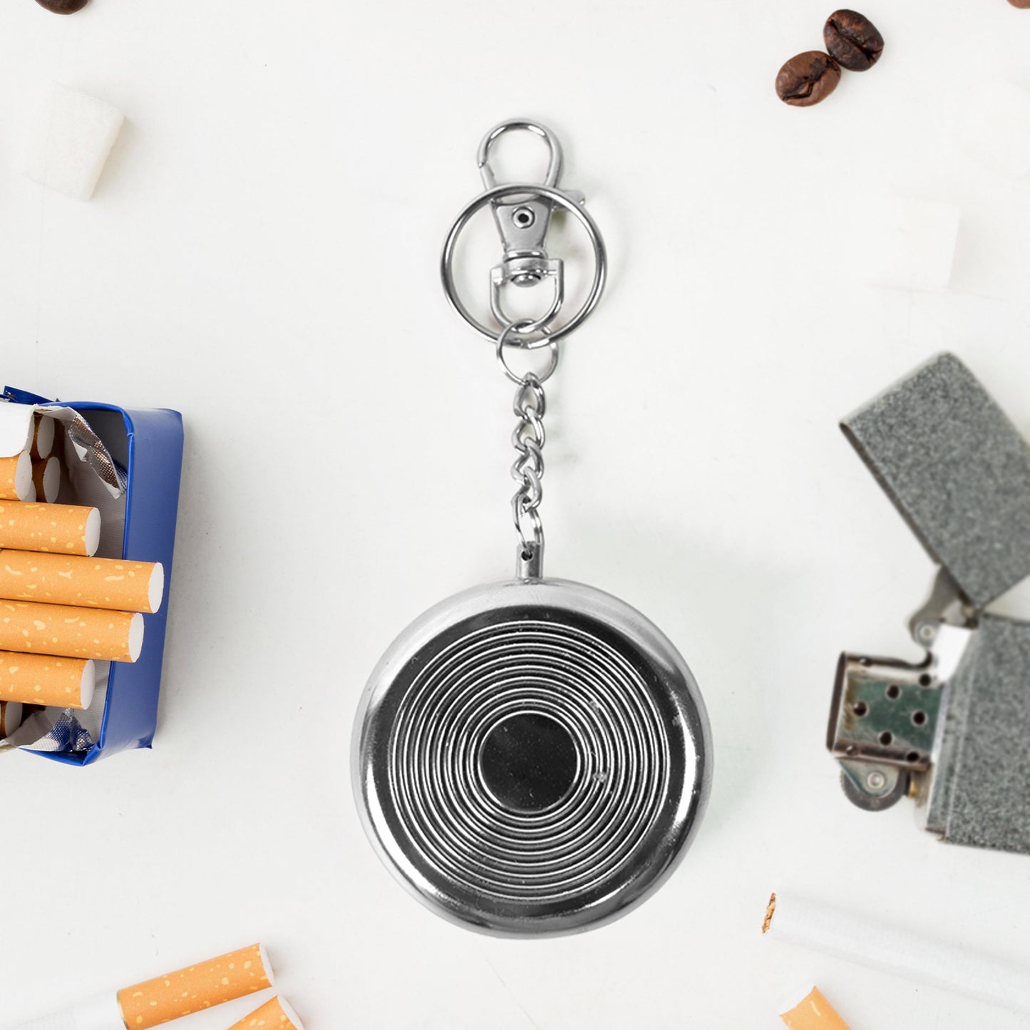 Wukusy mini pocket ashtray with keyring, compact metal design for discreet cigarette disposal, suitable for home or travel use.