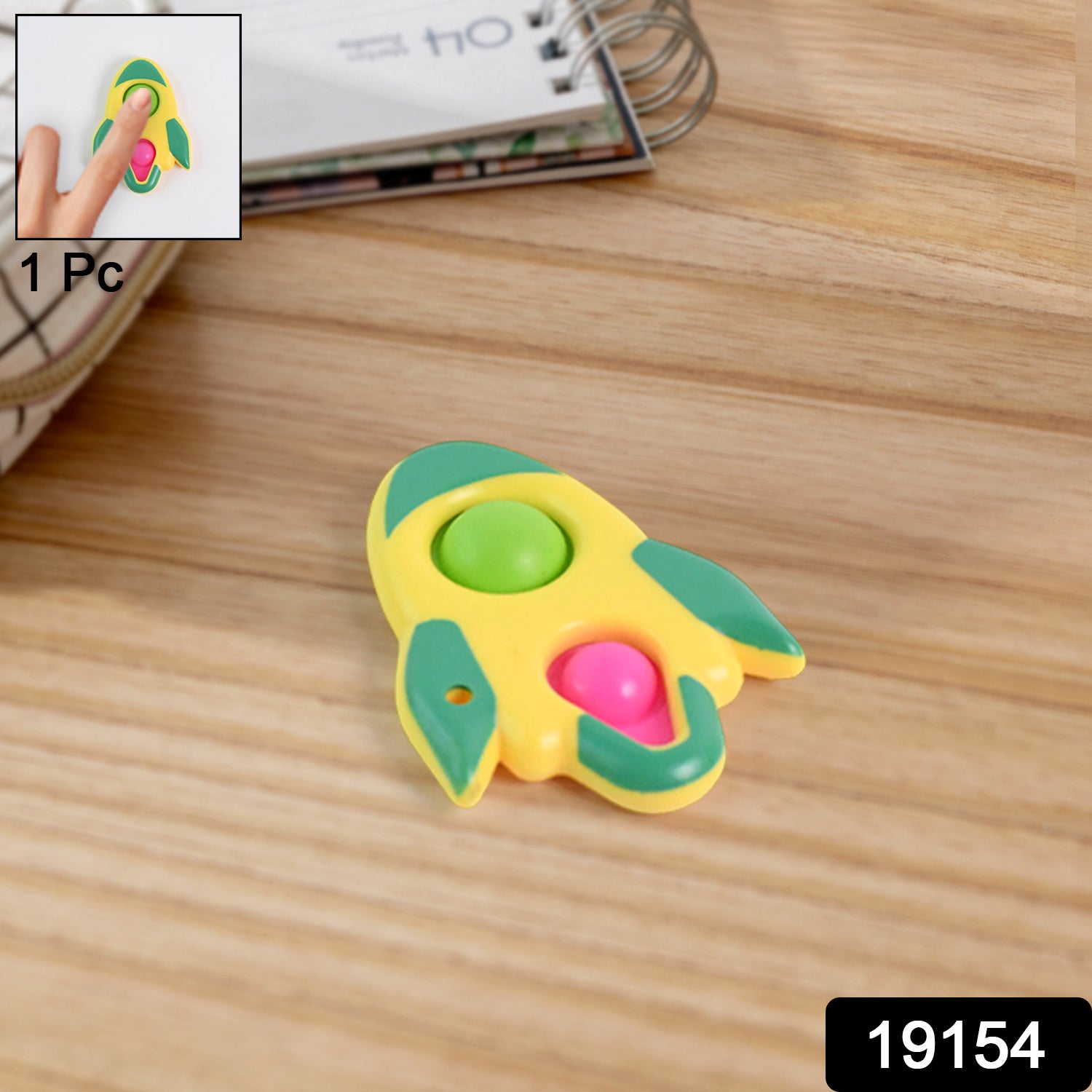 Rocket-shaped dimple keychain toy from Wukusy, featuring a playful, colorful rocket design with textured dimples for fun handling.