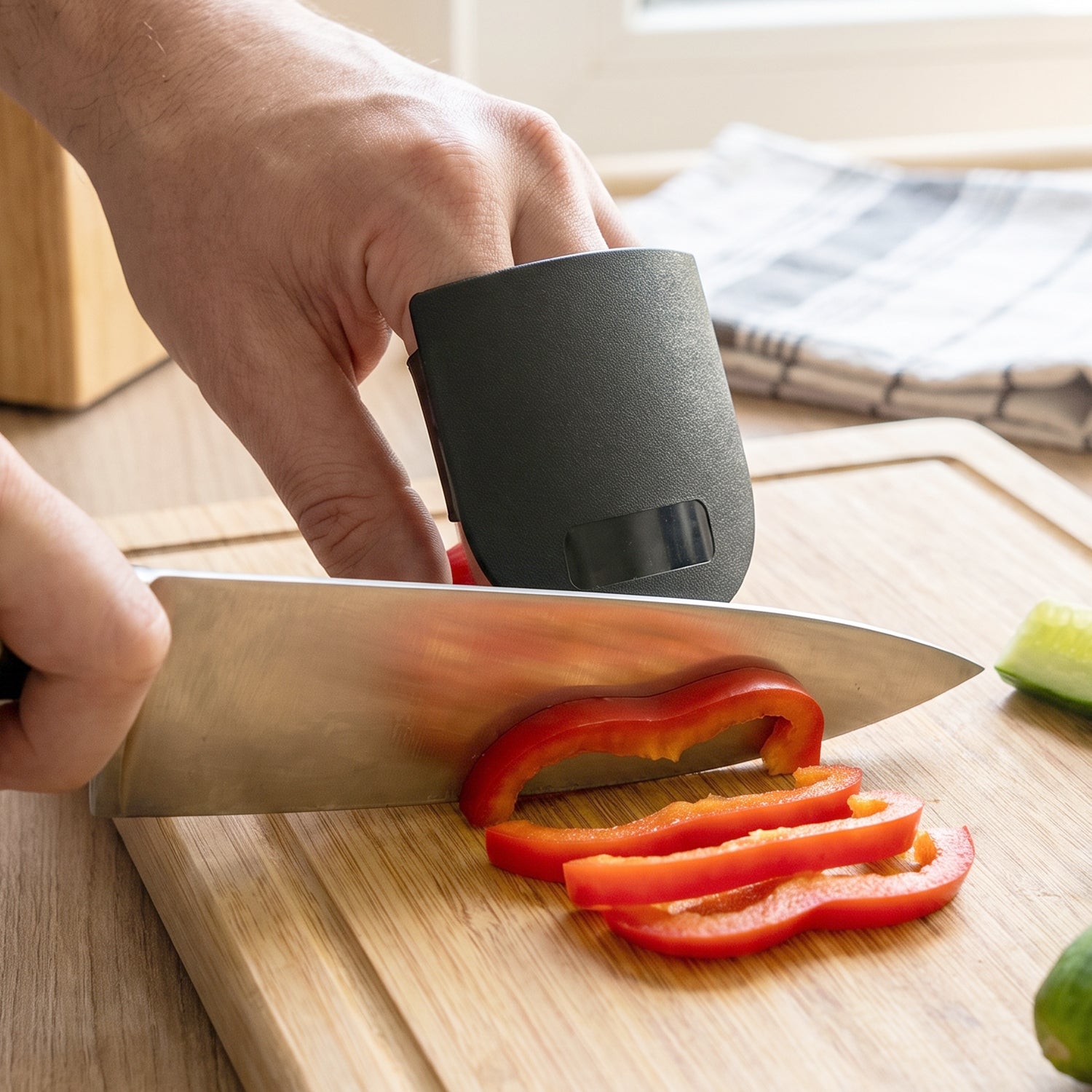 Wukusy finger guard protector for kitchen cutting, colorful safety tool worn on fingers to prevent cuts during chopping.