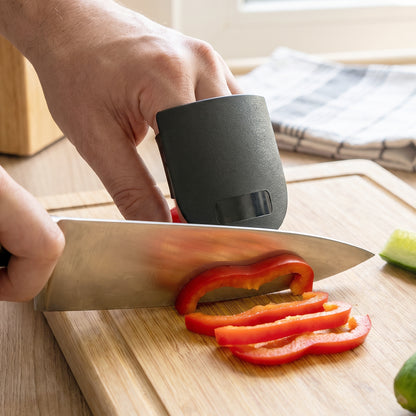 Wukusy finger guard protector for kitchen cutting, colorful safety tool worn on fingers to prevent cuts during chopping.