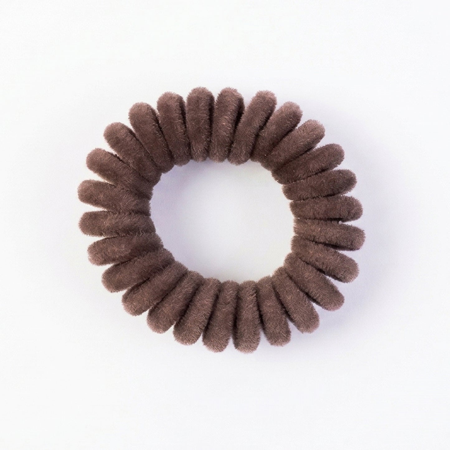 Soft stretchable telephone wire style hair band from Wukusy, shown in black, flexible and lightweight for comfortable hair styling.
