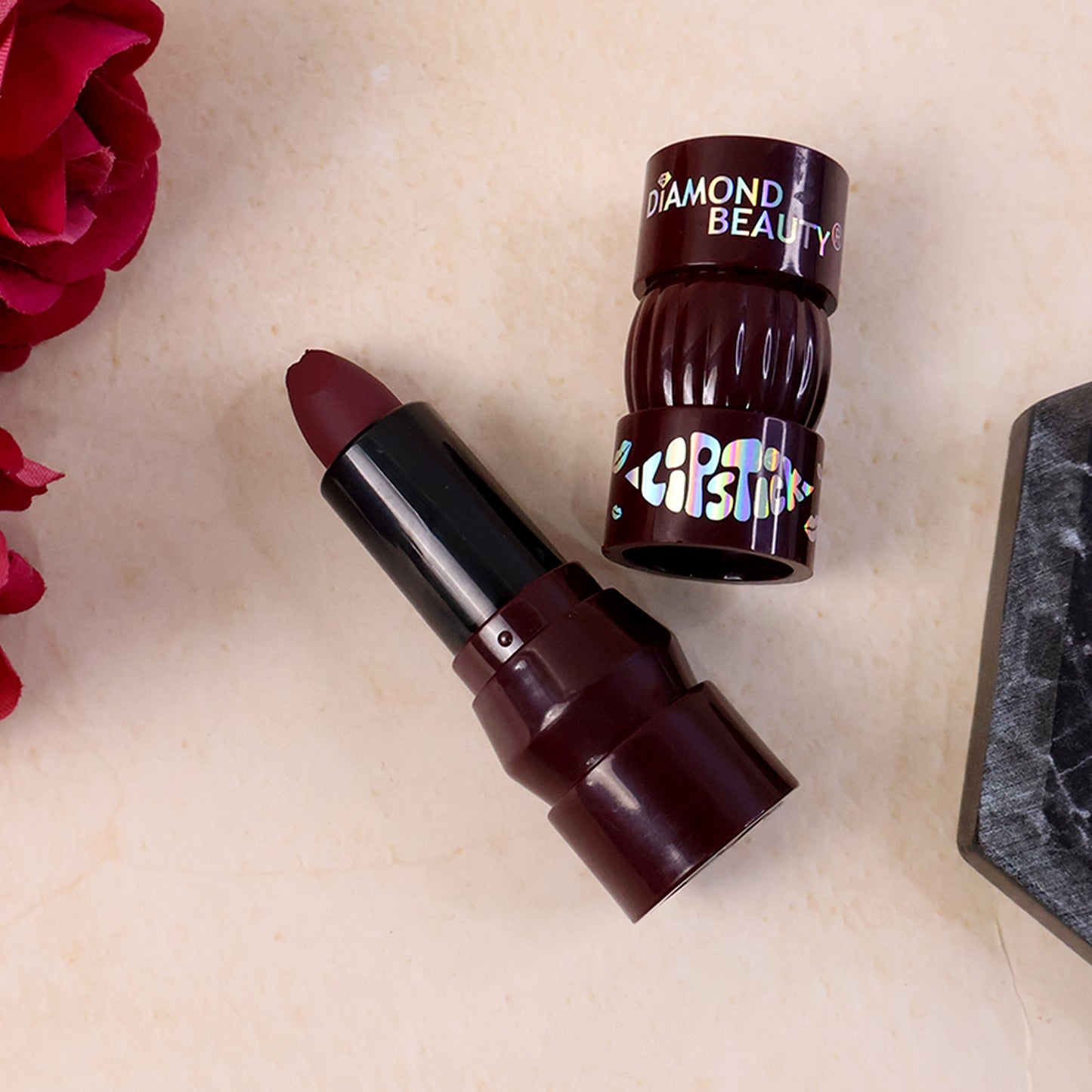 Wukusy Premium Diamond Beauty Matte Lipstick in mixed colors, showcasing a sleek lipstick tube with vibrant shades.