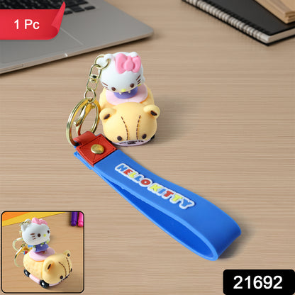 Silicone keychain featuring a cute cartoon cat riding a toy car, perfect for keys or bags, by Wukusy.