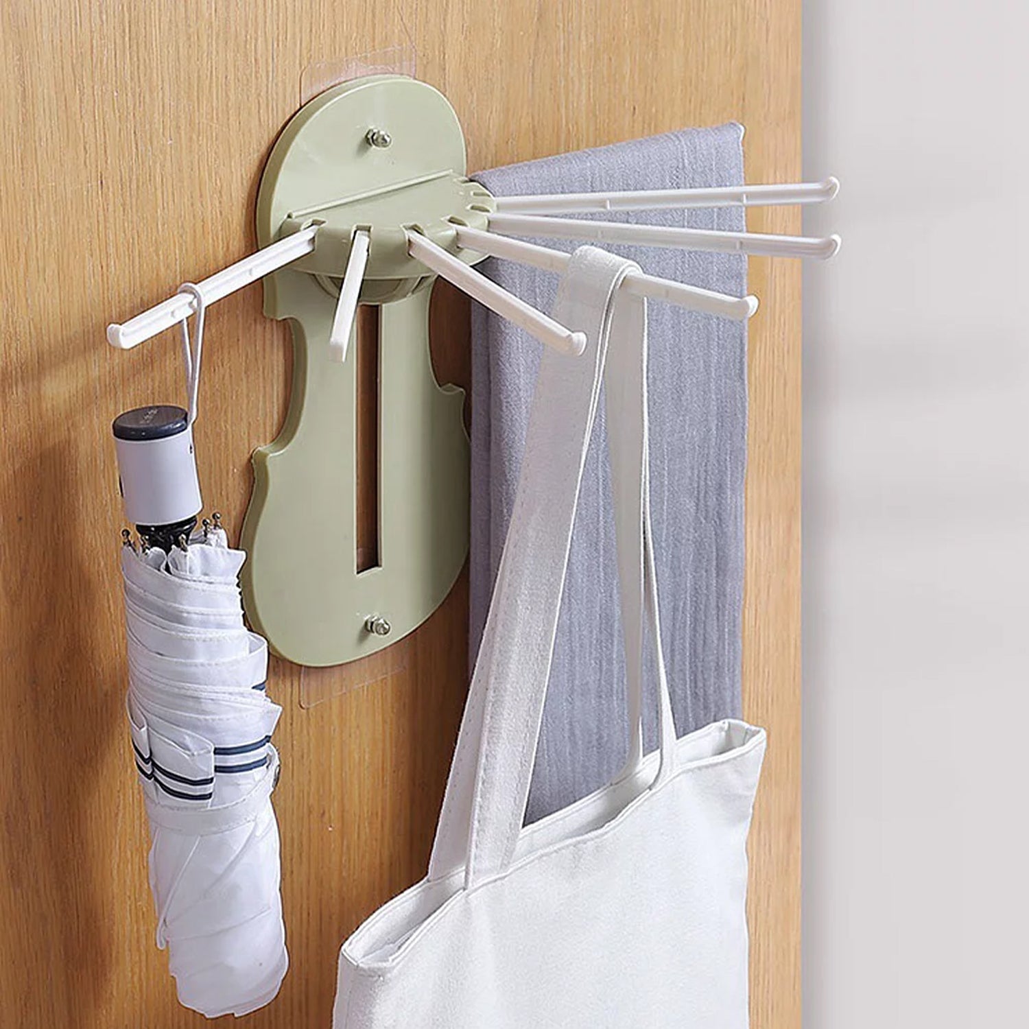 Wukusy 7728 plastic 7-in-1 retractable wall-mounted pull-out hanger rack with hooks for kitchen or bathroom storage.