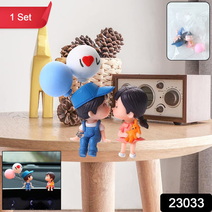 Wukusy plastic cute couple car dashboard figurine set with two adorable colorful characters on a smooth surface.