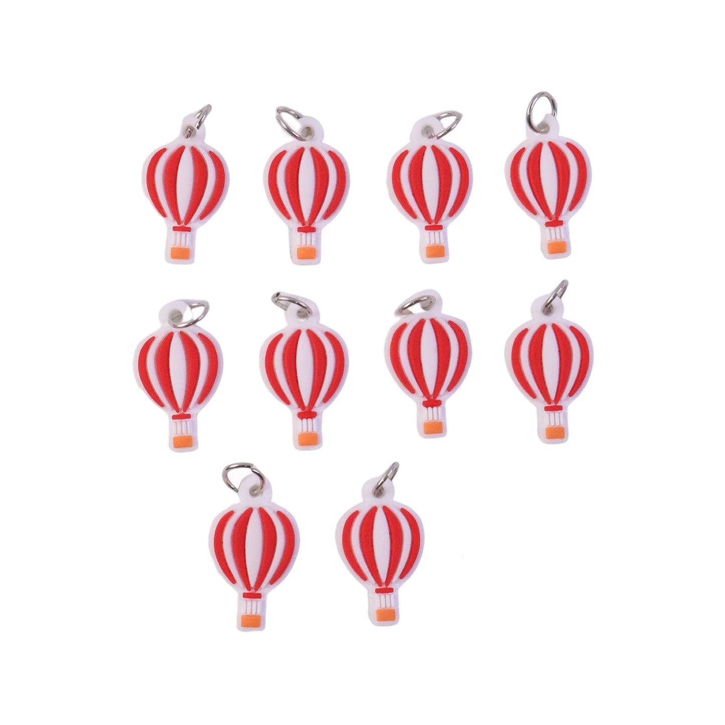 Set of nine colorful hot air balloon bag charm keychains by Wukusy, featuring vibrant designs and detailed craftsmanship.