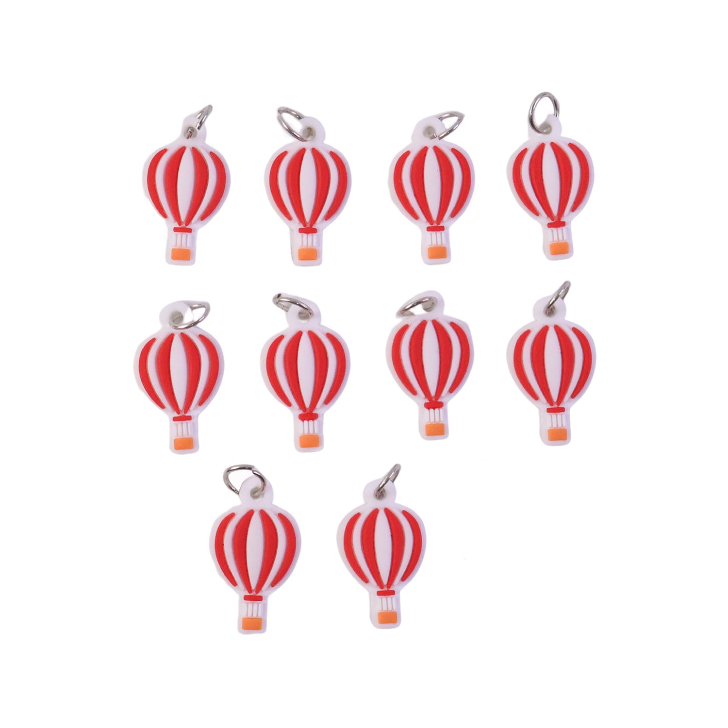Set of nine colorful hot air balloon bag charm keychains by Wukusy, featuring vibrant designs and detailed craftsmanship.