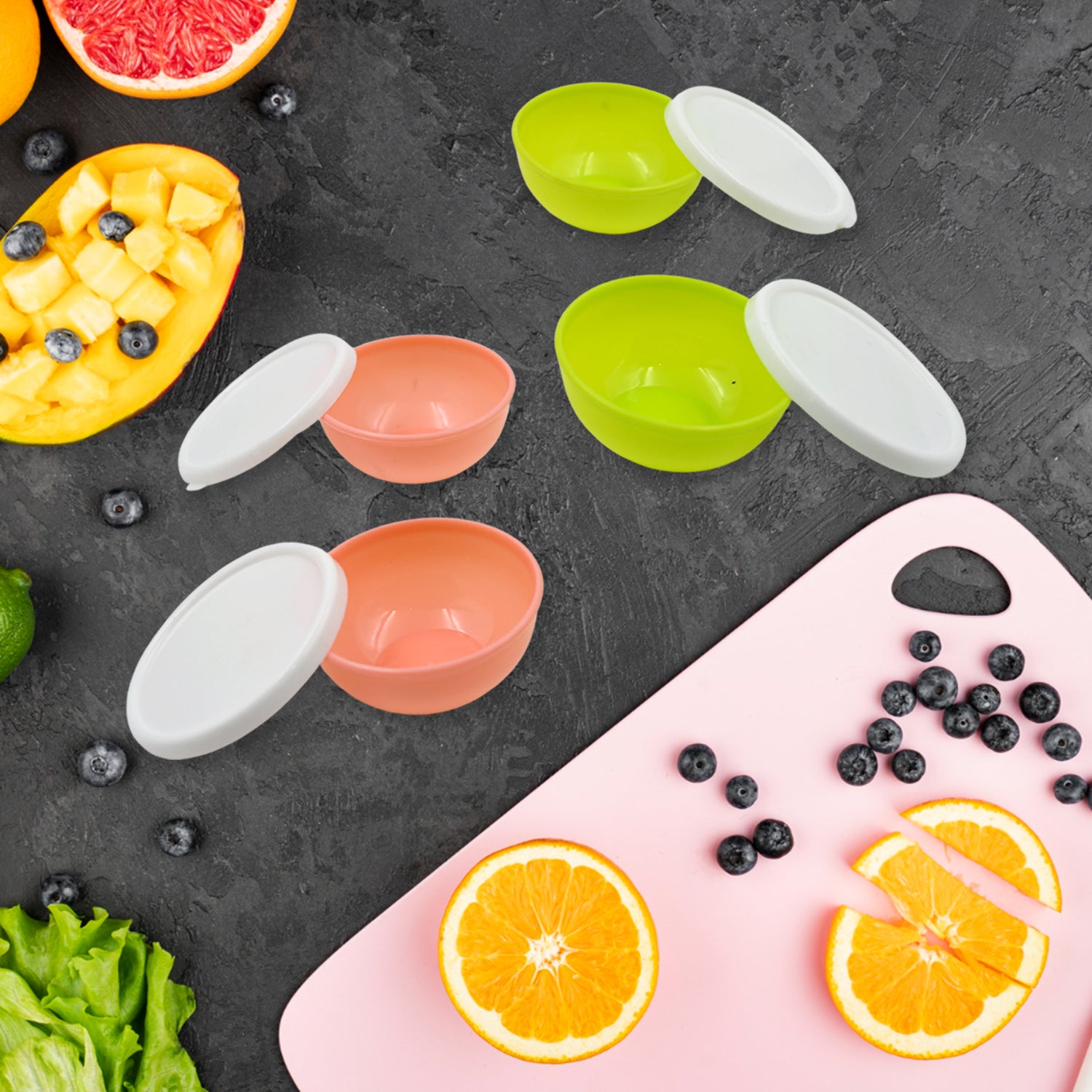 Set of four Wukusy small round plastic bowls with lids, microwave and dishwasher safe, lightweight, reusable chutney bowls.