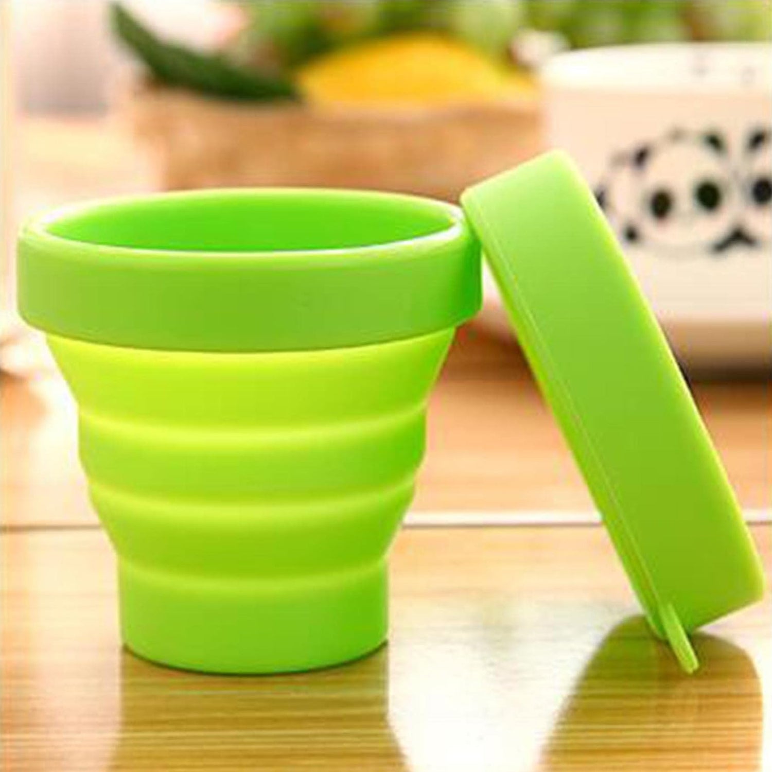 Wukusy round silicone foldable travel mug with lid, portable glass cup for on-the-go use, collapsible design for easy storage
