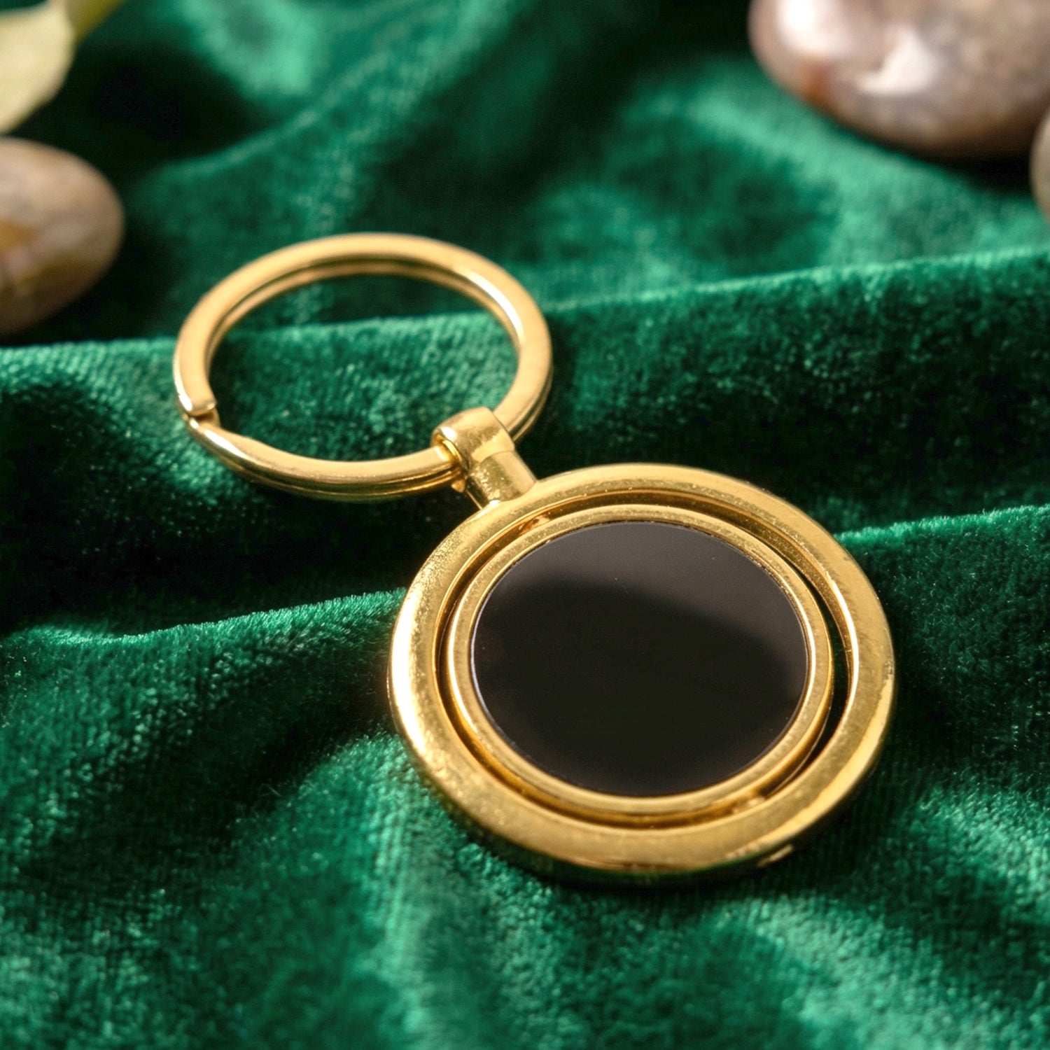 Gold plated keychain with black round rotating pendant from Wukusy, featuring a sleek, stylish design for everyday use.