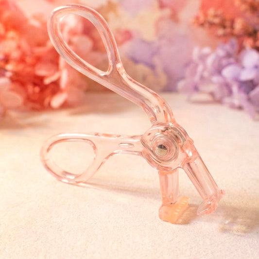 Wukusy premium transparent plastic eyelash curler with curved metal clamp for curling eyelashes effectively.
