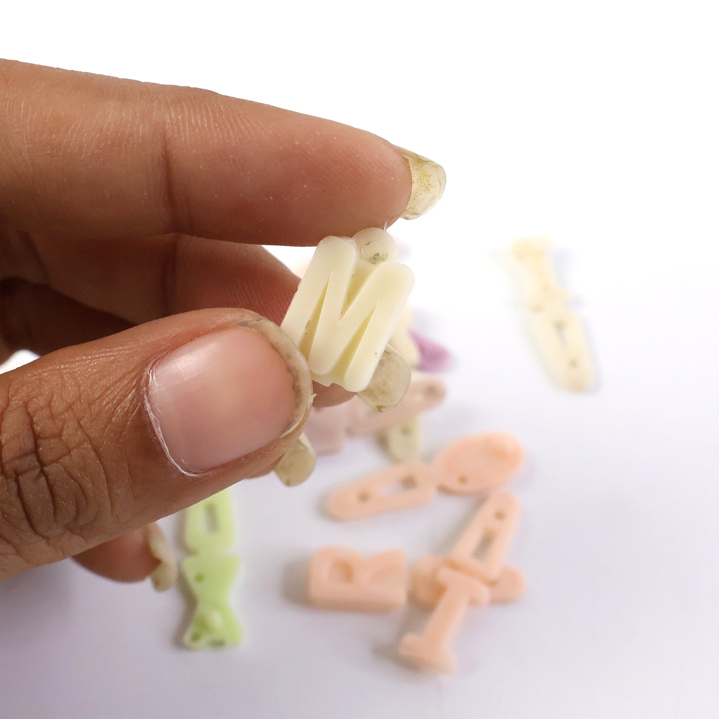 Set of colorful alphabet letter beads for craft decoration, featuring Wukusy brand office craft beads in a vibrant assortment.