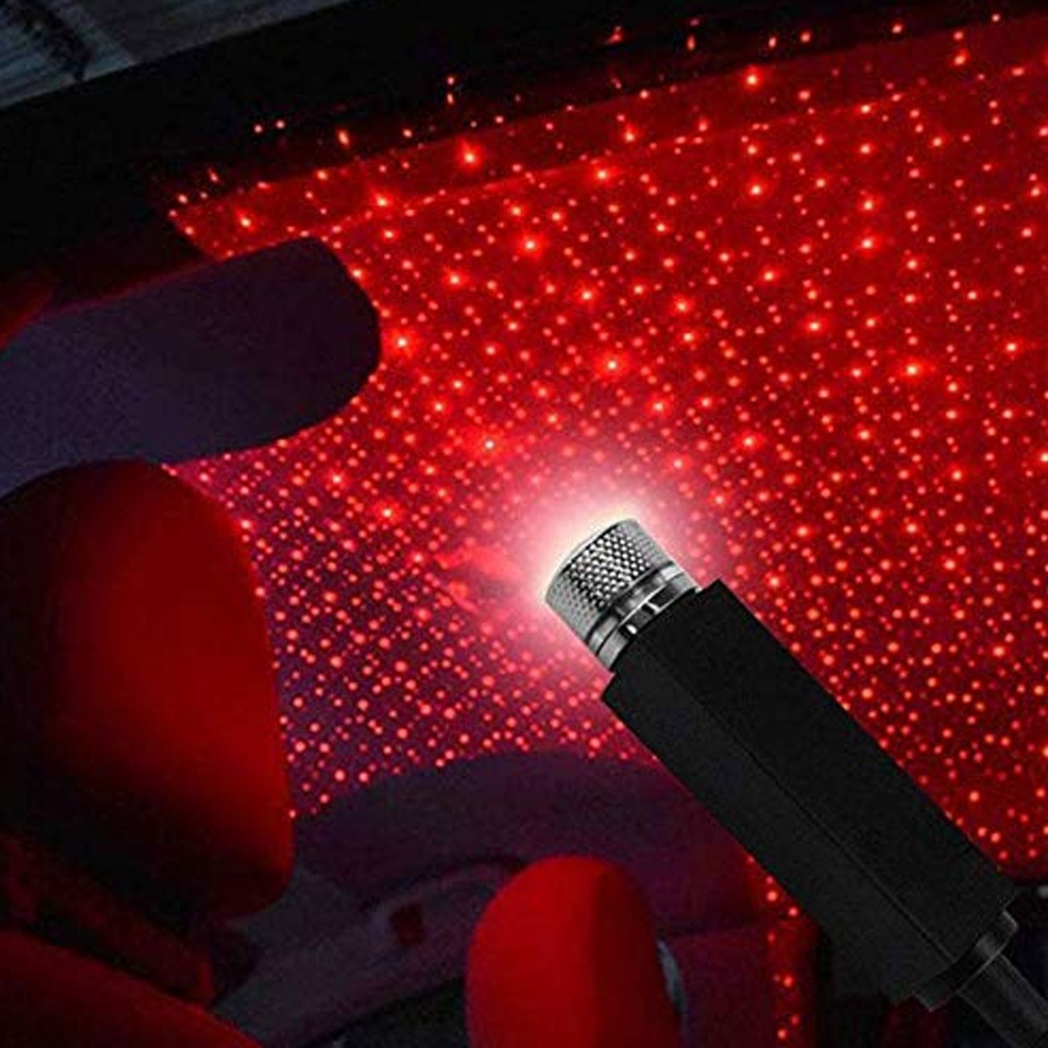 Wukusy 7290 multipurpose laser galaxy night sky ambiance projector projecting stars on a car ceiling and bedroom wall.