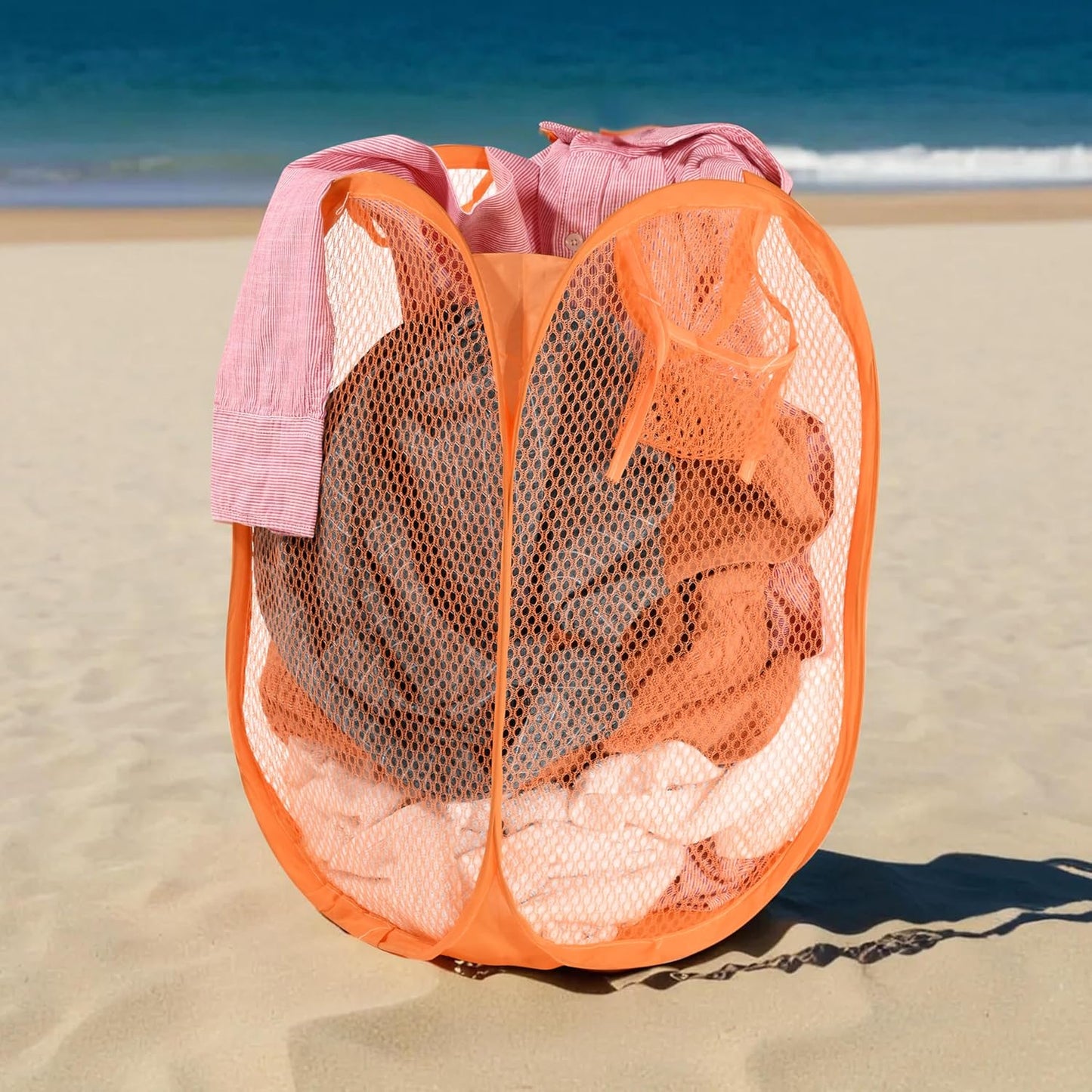Wukusy foldable pop-up mesh laundry basket hamper with breathable mesh sides and sturdy frame for easy laundry storage and transport.
